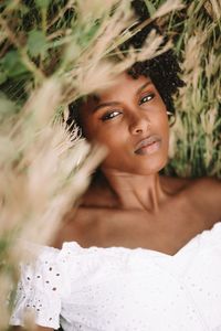 Young black woman relaxing in the grass