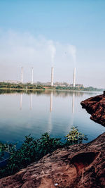 Scenic view of river against sky during sunrise