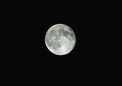 Low angle view of moon against sky at night