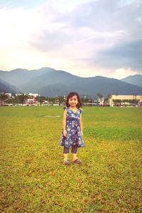 Full length of woman on field against sky