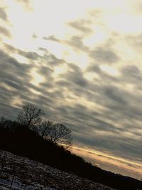 Scenic view of landscape against sky at sunset