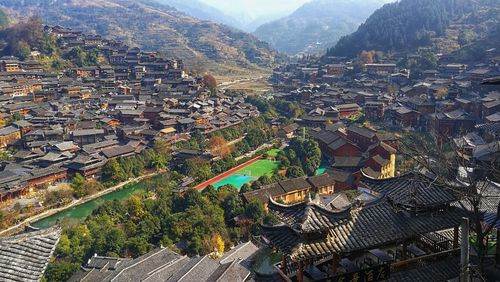 High angle view of townscape and mountains