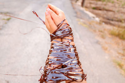 Close-up of hand with tape