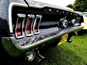 Close-up of vintage car on field