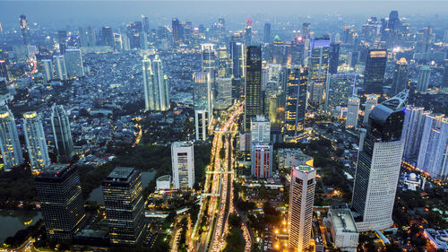 High angle view of illuminated buildings in city