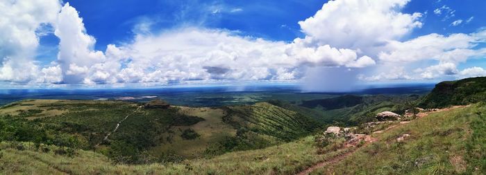 Panoramic view of sea and mountains against sky