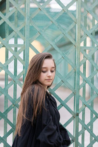 Portrait of young woman looking at camera