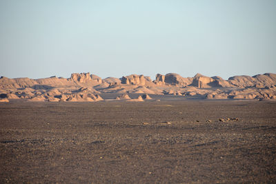 Scenic view of desert against clear sky