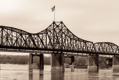 Tug boat creeping under the vicksburg bridge on a breezy morning. 