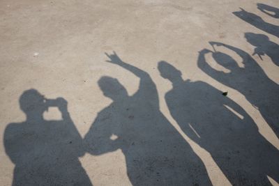 Shadow of people on street