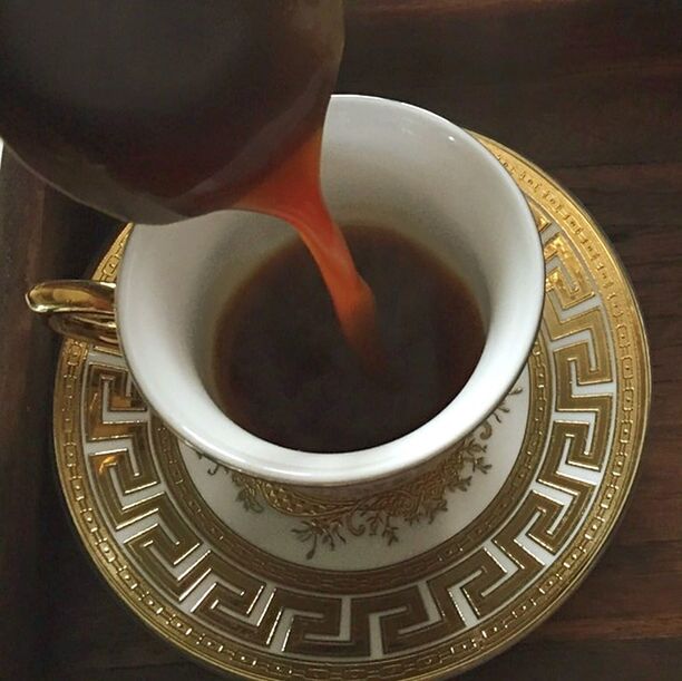 indoors, coffee cup, high angle view, directly above, food and drink, circle, close-up, coffee - drink, design, still life, saucer, table, freshness, no people, refreshment, drink, spiral, pattern, coffee, shape