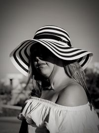 Close-up of woman wearing hat outdoors