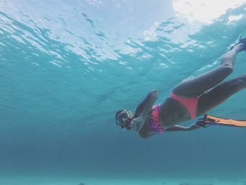 Woman swimming in sea