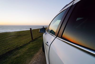 Scenic view of sea against clear sky during sunset