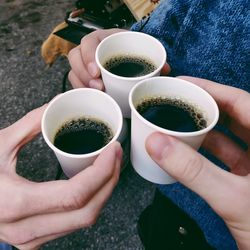 Cropped image of person holding coffee