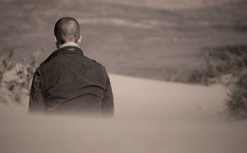 Rear view of man at desert