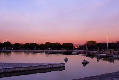 Scenic view of lake against sky during sunset