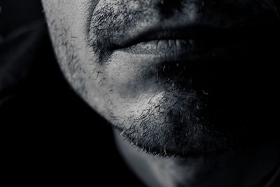 Close-up of hands over black background