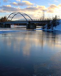 Bridge over river against sky