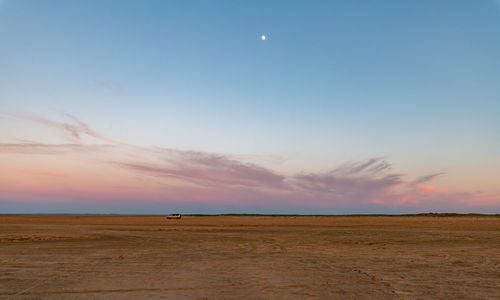 Scenic view of landscape against sky during sunset