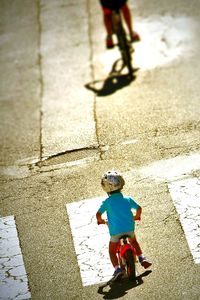 High angle view of boys walking on street