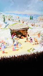 Multi colored horse against sky