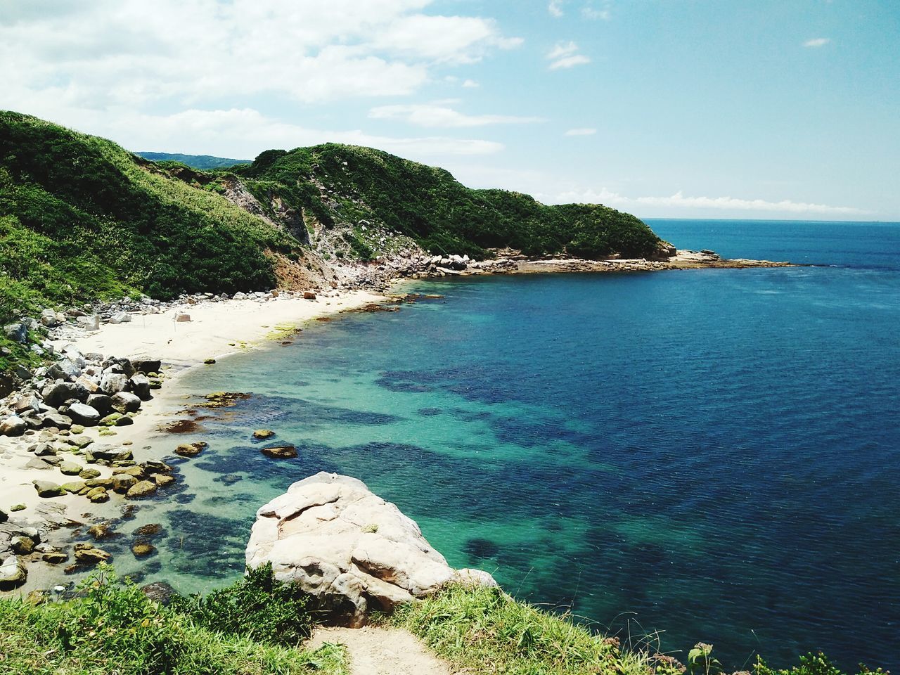 water, sea, horizon over water, sky, scenics, tranquil scene, tranquility, tree, beauty in nature, blue, nature, rock - object, high angle view, coastline, idyllic, cliff, day, green color, shore, cloud - sky