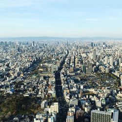 High angle view of city buildings against sky