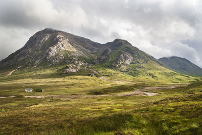 Scenic view of landscape and mountains against sky