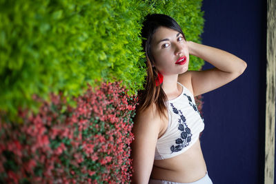 Portrait of a beautiful young woman looking away