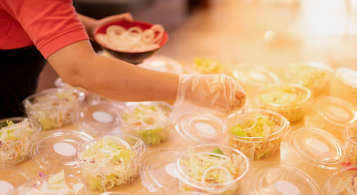 High angle view of person preparing food on table