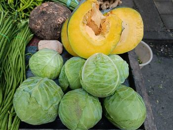 High angle view of pumpkins and cabbage for sale