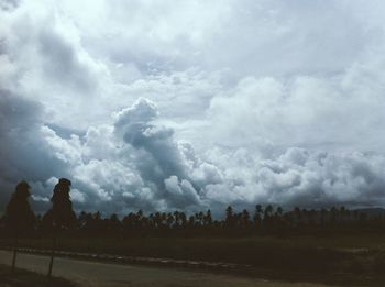 Scenic view of landscape against cloudy sky