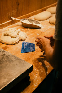 Midsection of man preparing food
