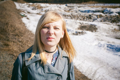 Portrait of woman standing at beach