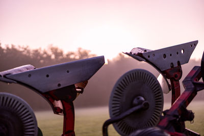 Low angle view of machinery against clear sky