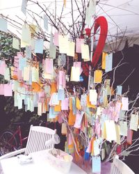 Multi colored umbrellas hanging on table at market stall