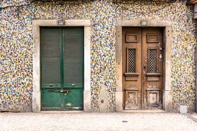 Closed doors of building 38 and 38a sourunded by tiny tiles