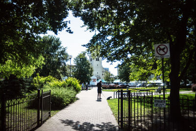 People walking dog on footpath