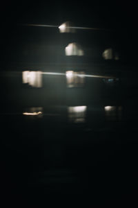 Defocused image of illuminated lights at night