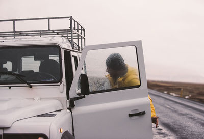 Man on road against clear sky