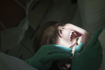 Close-up of dentist treatment to patient 