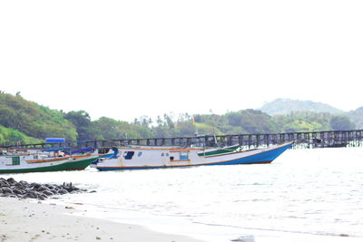 Scenic view of beach against clear sky