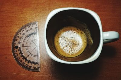 High angle view of coffee cup on table