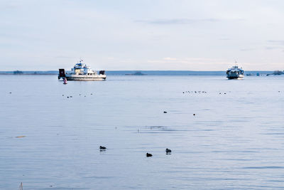 Fishing boats in the sea. ferry on the winter sea. winter sea landscape