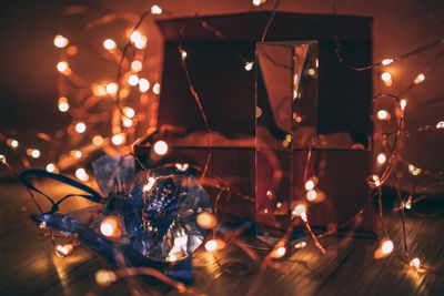 Close-up of illuminated christmas lights on table