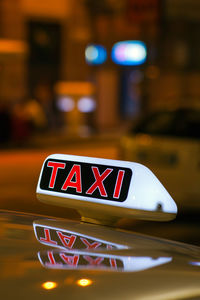 Close-up of car on street at night