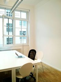 Laptop on conference table in office