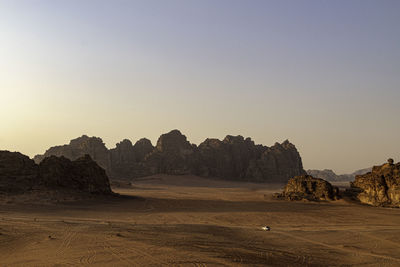 Rock formations in desert against clear sky