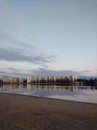 Scenic view of beach against sky during sunset